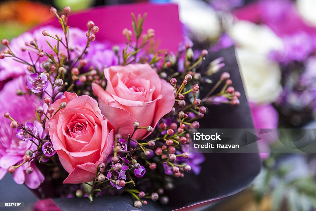 Elegant Bouquet Close-up image of a beautiful flowers bouquet with two pink roses. Anniversary Stock Photo