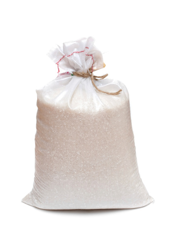 Close up of the bag with rice isolated on white background.