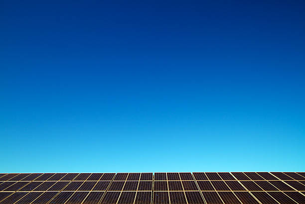 Solar panels against blue sky stock photo