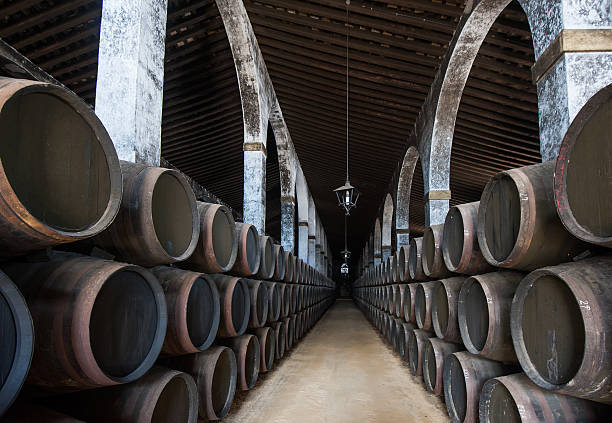 Sherry barrels in Jerez bodega, Spain Sherry barrels in Jerez bodega, Spain jerez de la frontera stock pictures, royalty-free photos & images