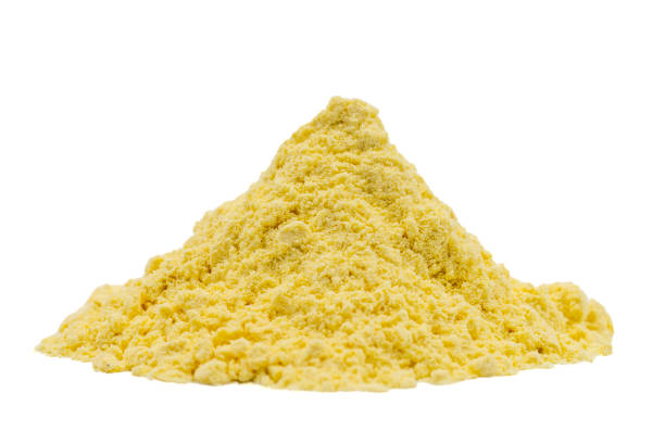 istock Corn flour isolated on white background. Pile of cornmeal. close up 1532834112