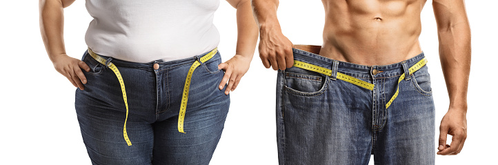 Weight loss, overweight woman and a fit man in a big pair of jeans isolated on white background