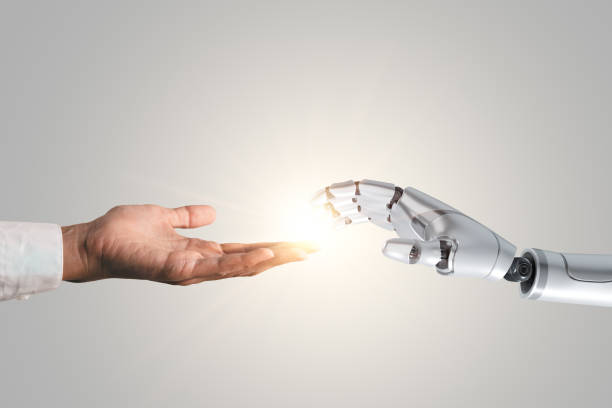 istock Business man and robot hand touching with flare light. AI artificial intelligence concept, big data, science, innovation technology, cloud computing, futuristic, internet network communication 1532850299