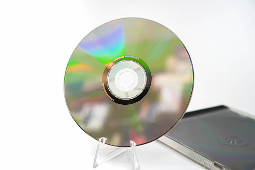 close up of compact disc on plain background