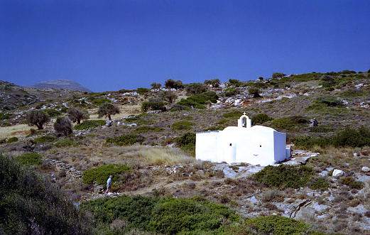 analogue photo of a Cycladic church in the middle of the Paros countryside