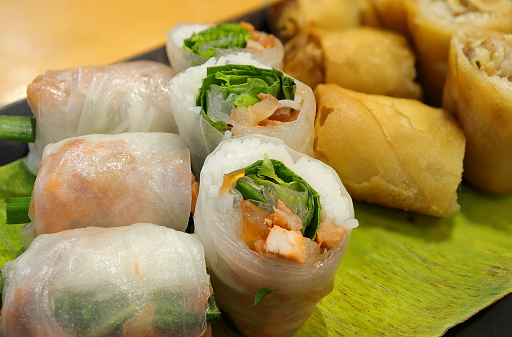 Vietnamese cuisine, Fresh spring rolls with vegetables and dipping sauce, Healthy vegetarian spring rolls, rice noodles rolls with vegetables.