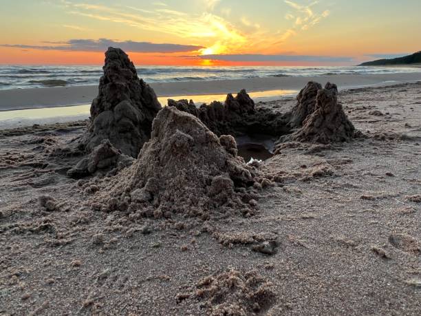 istock sand castles on the seashore, wonderfully colored sky, sunset, sunrise 1532900176