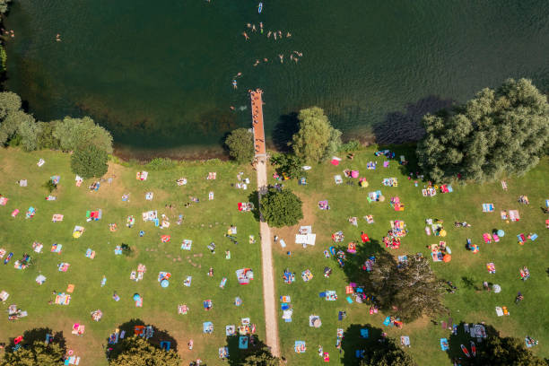 istock People sunbathing and swimming, aerial view 1532922909