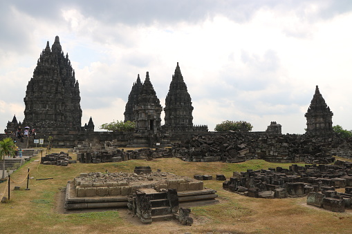 Yogyakarta, Indonesia - July 08, 2023: Tourists are enjoying the view of Candi Prambanan which is the largest Hindu temple in Indonesia. The original plan of the Prambanan Temple is rectangular in shape, consisting of an outer courtyard and three courts.