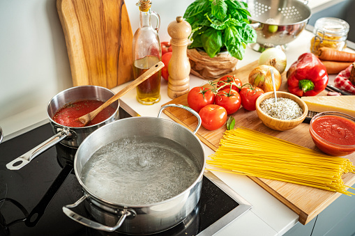 Ingredients for Italian spaghetti recipe on kitchen counter