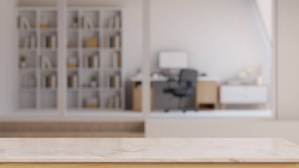 istock An empty mockup space on a tabletop with a blurred modern office room as a background. 1532954691