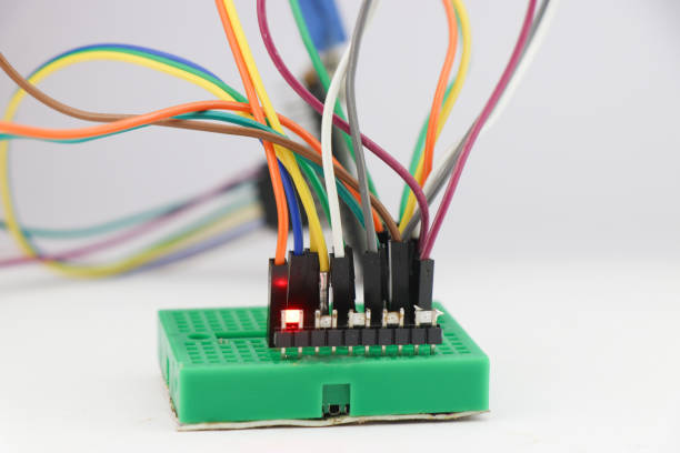 istock SMD LED or light emitting diodes connected to breadboard using jumper wires and controlled by a micro controller in the background 1532969952