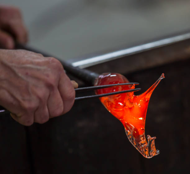 istock Glass blower at work shaping molten glass, Murano 1532977396