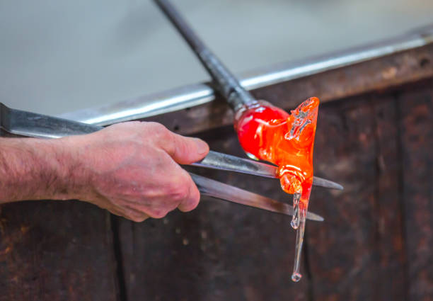 istock Glass blower at work shaping molten glass, Murano 1532979298