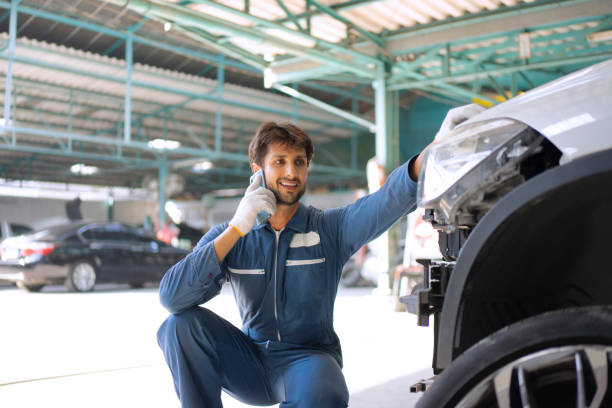 istock Young entrepreneur work at car garage. 1532981906
