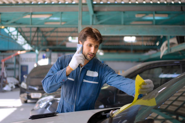 istock Young entrepreneur work at car garage. 1532982969