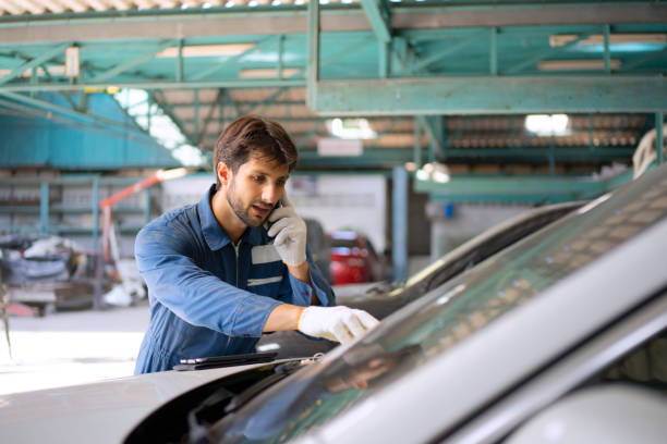 istock Young entrepreneur work at car garage. 1532983492