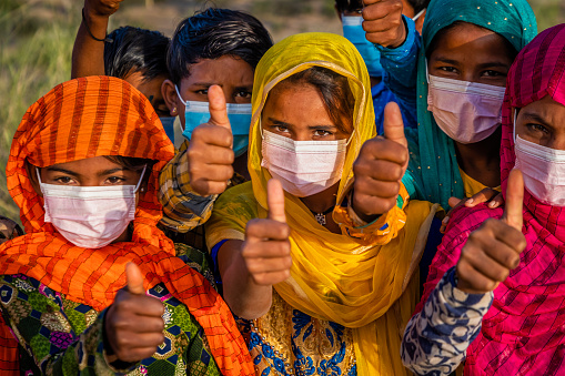 Group of Indian children wearing face masks - desert village, Thar Desert, Rajasthan, India.