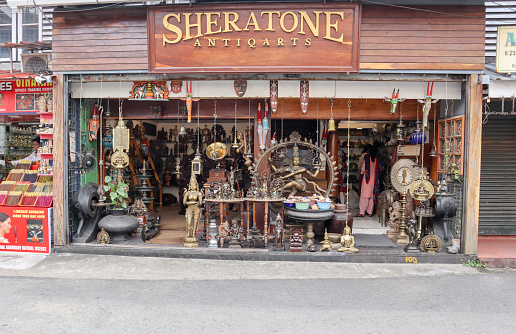 Kochi, Kerala, India-October 6 2022; A Street picture of an Antique shop selling old Bronze and Copper artifacts  including sculptures of Hindu deities in Jew Town of Kochi city in Kerala, India.