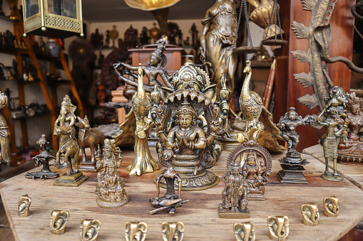 Kochi, Kerala, India-October 6 2022; A Close up picture of a few old antique artifacts of Hindu Gods and Goddesses made in Bronze metal in the Jew town of Kochi in Kerala, India.