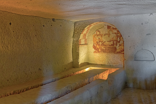Refectory of Sandal church with scene of the Last Supper in wall niche. Goreme Open air museum. June 16, 2022 - Cappadocia, Turkey