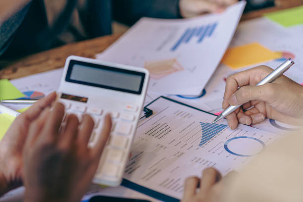 istock Analyzing business finance report on financial graph document during discussion at company meeting showing successful teamwork. Business Accounting Concepts close up pictures 1533005794
