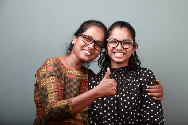 loving moments of an indian ethnic mother and daughter - facial expression child asia asian and indian ethnicities imagens e fotografias de stock