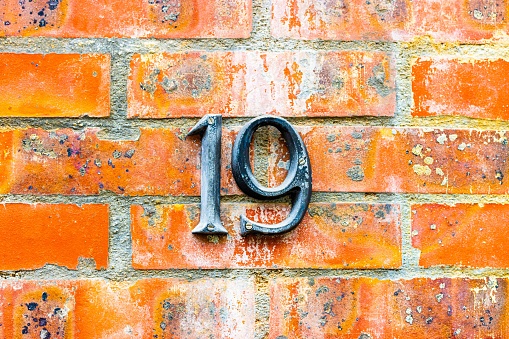 number 19 on old brick wall
