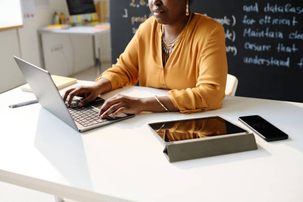 istock Teacher working online on laptop at class 1533106581