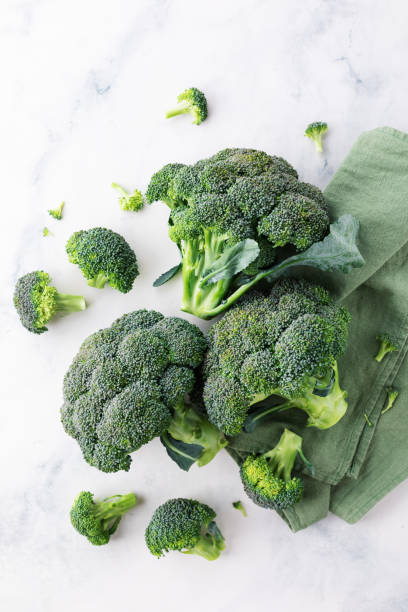 istock Fresh green broccoli on stone table top view. 1533130789