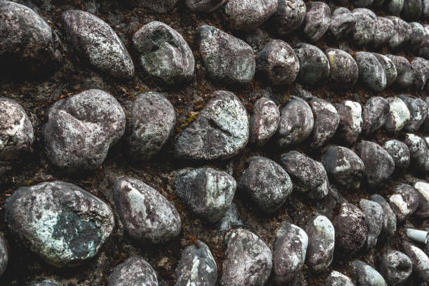 Photograph of rounded flint cobbles set into a wall