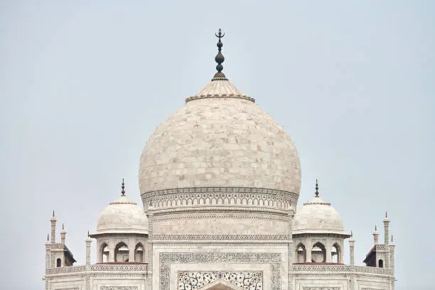 Photo of Close up Taj Mahal dome white marble mausoleum landmark in Agra, Uttar Pradesh, India,