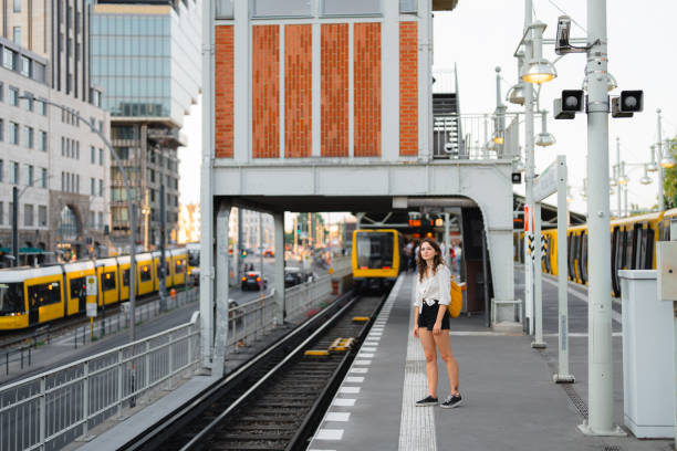 istock Woman with backpack standing on the train station in Berlin 1533258813