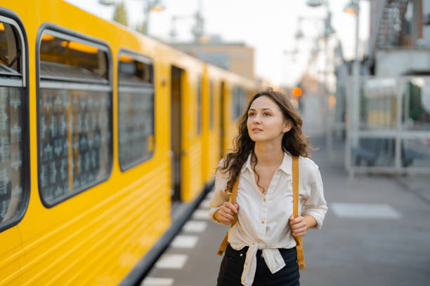 istock Woman with backpack standing on the train station in Berlin 1533261207