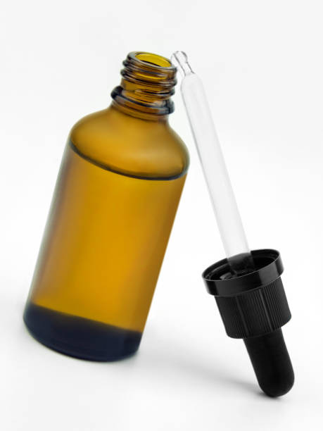 istock Brown glass bottle with pipette on white background 1533290195