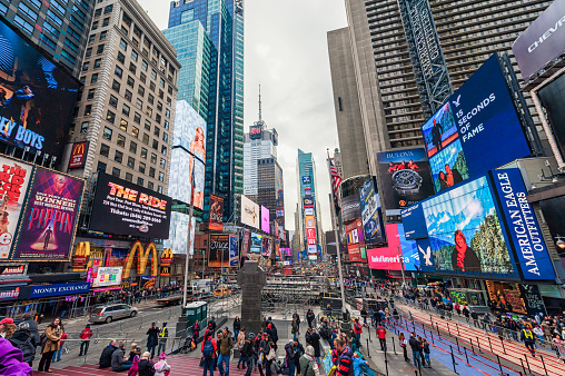 Manhattan, NYC - December 27, 2013: New York Times Square with Tourists. Manhattan, USA