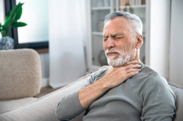 istock Mature man suffering from strong throat sore 1533312604