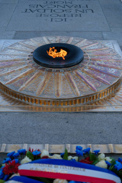 Paris, France - June 25, 2023 : View of the eternal flame at the tomb of the unknown soldier at the Arc de Triomphe in Paris France