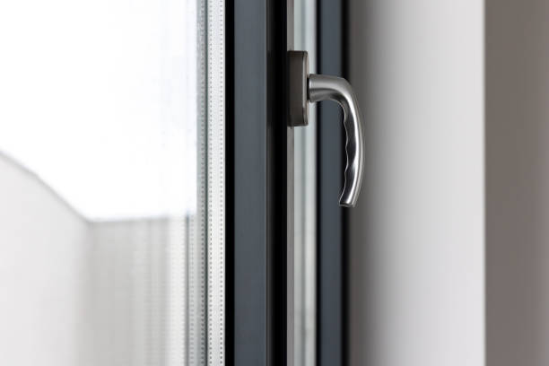 istock Tilt and turn window handle in a large window in a public building. 1533383891