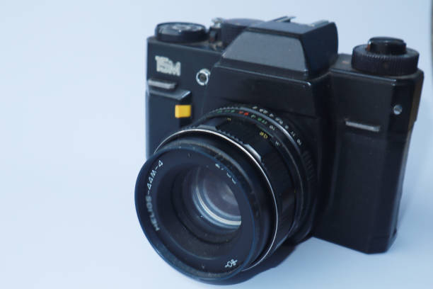 istock Vintage photo camera, isolated on white 1533396643