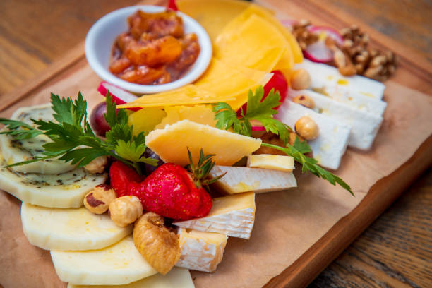 istock Cheese assortment appetizer on wooden board in fine dining 1533418947