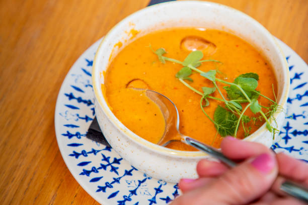 istock Eating pumpkin potage, served with ice in bowl on restaurant table 1533422291