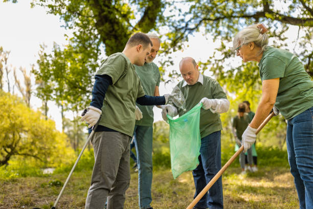istock Group of volunteers collecting trash in a forest 1533430818