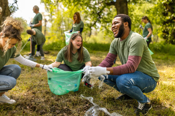 istock Group of volunteers collecting trash in a forest 1533430819