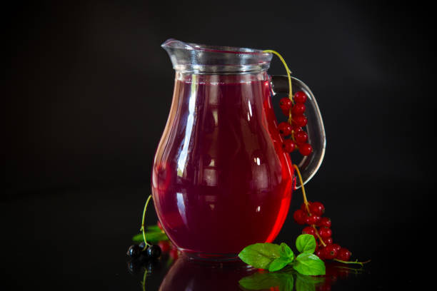 istock Cold refreshing drink from fresh summer berries in a decanter. 1533434498