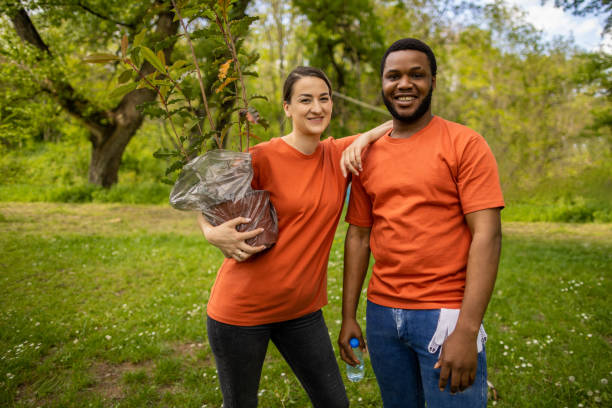 istock Portrait of man and woman with a tree sapling 1533443530