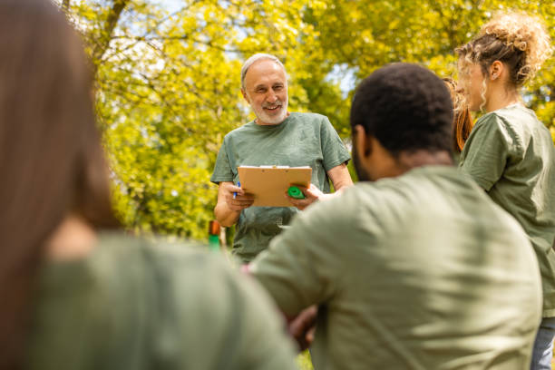 istock Group of activists taking a break from collecting garbage 1533452536