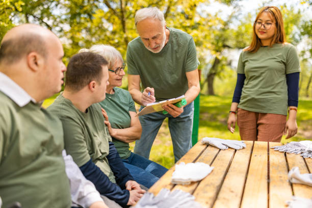 istock Group of activists taking a break from collecting garbage 1533452538