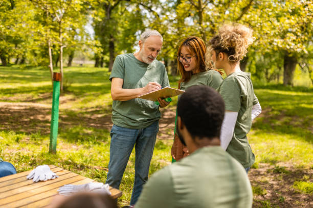 istock Group of activists taking a break from collecting garbage 1533454613