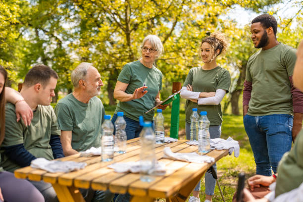 istock Group of activists taking a break from collecting garbage 1533454614